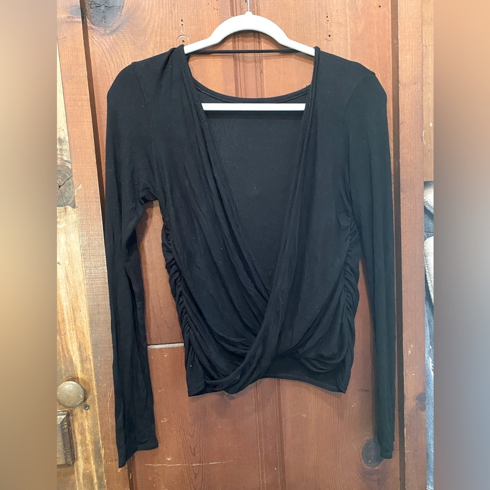 Low cut long sleeve waterfall top.